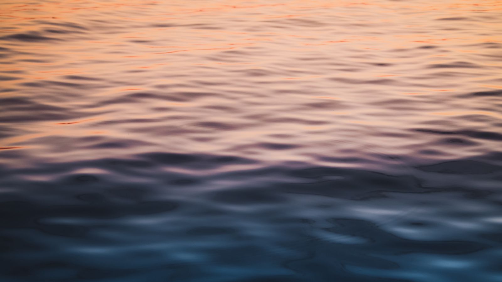 1600x900 Wallpaper water, waves, wavy, ripples, glare, sea