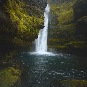 Preview wallpaper waterfall, cliff, moss, water, stones