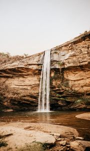 Preview wallpaper waterfall, cliff, river, stones, shore