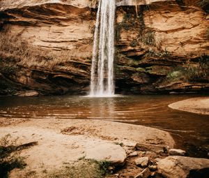 Preview wallpaper waterfall, cliff, river, stones, shore