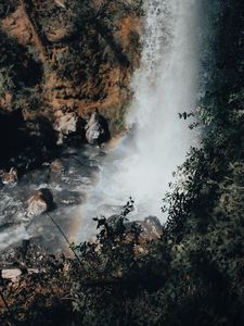 Preview wallpaper waterfall, cliff, stones, spray, rainbow