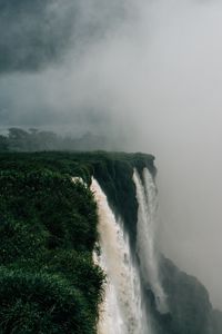 Preview wallpaper waterfall, fog, cliff, grass, greens