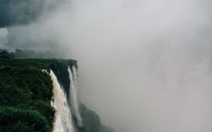 Preview wallpaper waterfall, fog, cliff, grass, greens