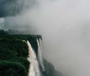 Preview wallpaper waterfall, fog, cliff, grass, greens