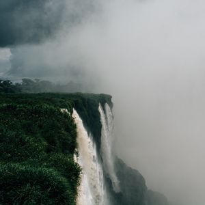 Preview wallpaper waterfall, fog, cliff, grass, greens