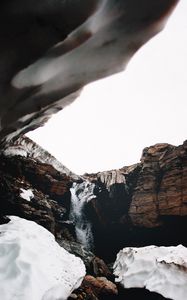 Preview wallpaper waterfall, gorge, snow, rocks
