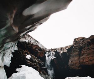 Preview wallpaper waterfall, gorge, snow, rocks