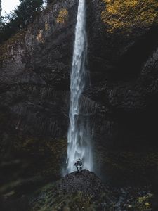 Preview wallpaper waterfall, human, rock, cliff, water