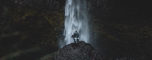 Preview wallpaper waterfall, human, rock, cliff, water