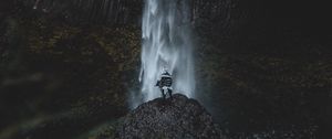 Preview wallpaper waterfall, human, rock, cliff, water