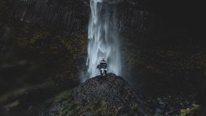 Preview wallpaper waterfall, human, rock, cliff, water