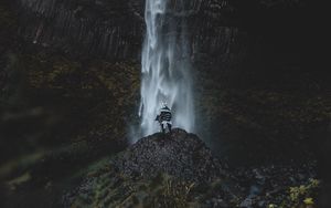 Preview wallpaper waterfall, human, rock, cliff, water