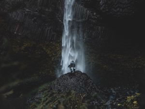 Preview wallpaper waterfall, human, rock, cliff, water