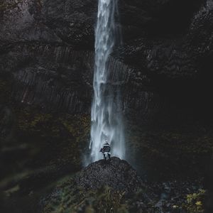 Preview wallpaper waterfall, human, rock, cliff, water