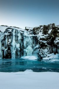 Preview wallpaper waterfall, ice, snow, winter, cliff, twilight
