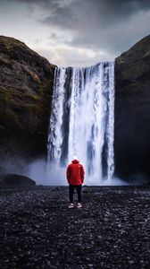 Preview wallpaper waterfall, man, shore, cliff, nature
