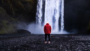 Preview wallpaper waterfall, man, shore, cliff, nature