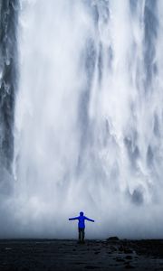 Preview wallpaper waterfall, man, silhouette, cliff, water