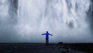 Preview wallpaper waterfall, man, silhouette, cliff, water