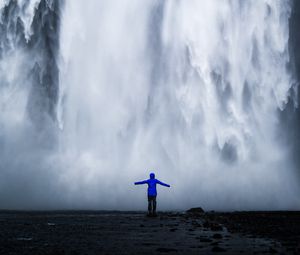 Preview wallpaper waterfall, man, silhouette, cliff, water