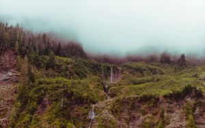 Preview wallpaper waterfall, mountain, cliff, fog, sky