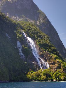 Preview wallpaper waterfall, mountain, trees, sea