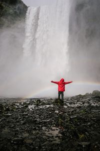 Preview wallpaper waterfall, rainbow, spray, water, man