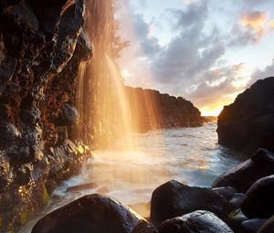 Preview wallpaper waterfall, rays, sun, light, reflection, rocks