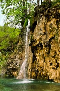 Preview wallpaper waterfall, river, currents, grass, stones, trees