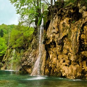 Preview wallpaper waterfall, river, currents, grass, stones, trees