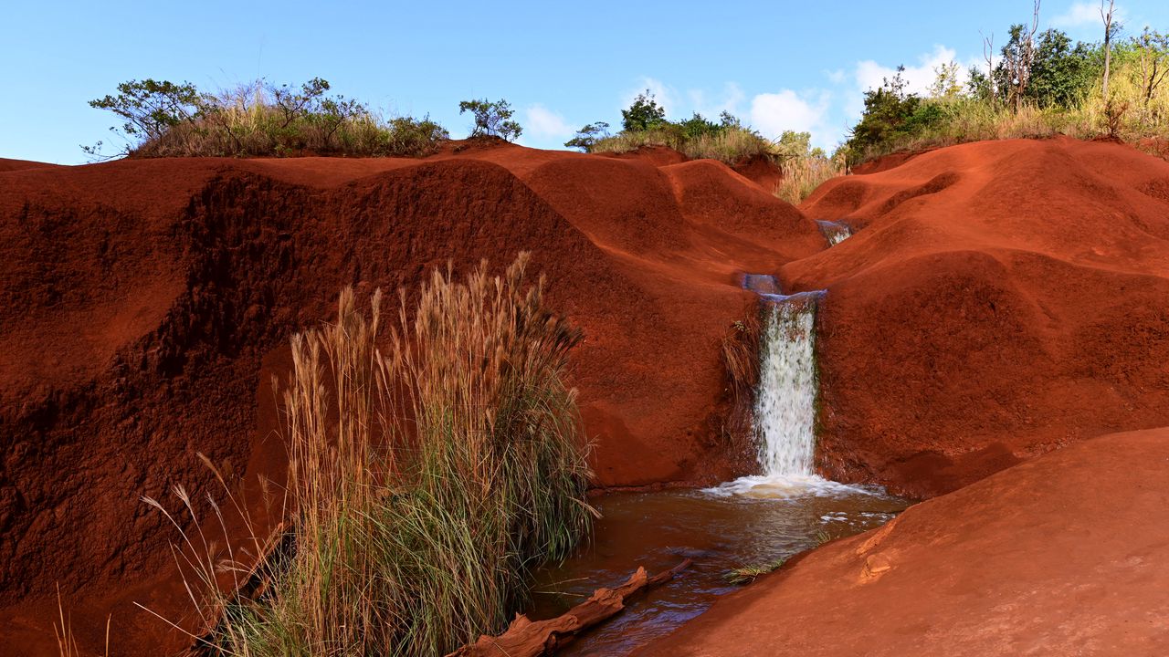 Wallpaper waterfall, river, sand, bushes, sky