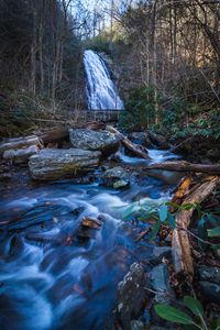 Preview wallpaper waterfall, river, stones, logs, trees