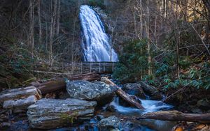 Preview wallpaper waterfall, river, stones, logs, trees