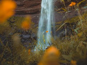 Preview wallpaper waterfall, rock, cliff, grass, flowers, nature