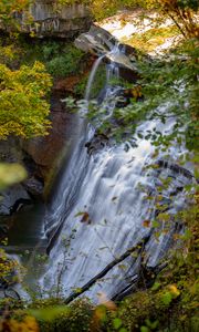 Preview wallpaper waterfall, rock, landscape, nature, leaves