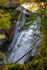 Preview wallpaper waterfall, rock, landscape, nature, leaves