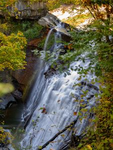 Preview wallpaper waterfall, rock, landscape, nature, leaves