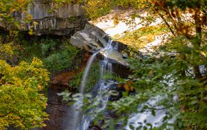 Preview wallpaper waterfall, rock, landscape, nature, leaves