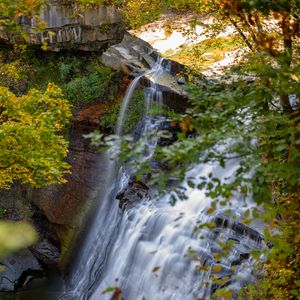 Preview wallpaper waterfall, rock, landscape, nature, leaves