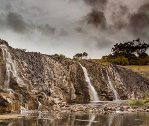 Preview wallpaper waterfall, rocks, cliff, trees, stones