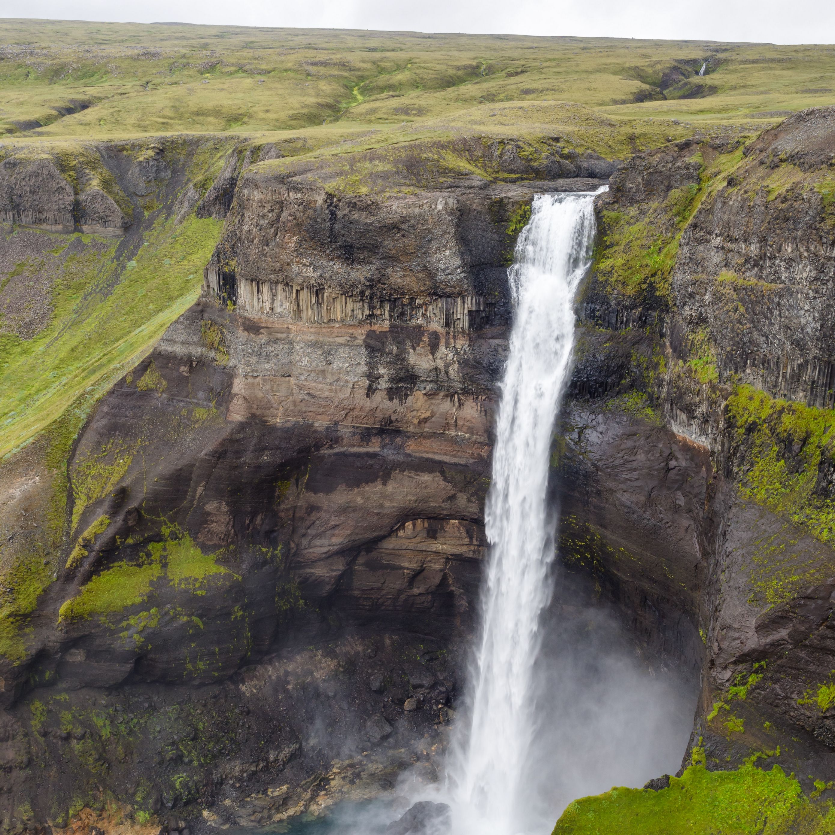 Download Wallpaper 2780x2780 Waterfall Rocks Cliff Grass Stones 