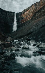 Preview wallpaper waterfall, rocks, cliff, stream, stones