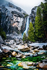 Preview wallpaper waterfall, rocks, cliff, stones, river, trees