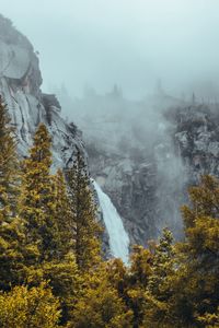 Preview wallpaper waterfall, rocks, mountains, trees, landscape, fog