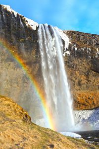 Preview wallpaper waterfall, rocks, rainbow, snow