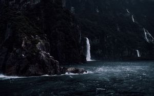 Preview wallpaper waterfall, rocks, sea, cliff, stones