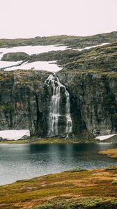 Preview wallpaper waterfall, rocks, sea, cliff, stones, water