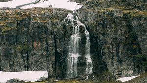 Preview wallpaper waterfall, rocks, sea, cliff, stones, water