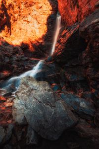 Preview wallpaper waterfall, rocks, stones, stream, light