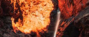 Preview wallpaper waterfall, rocks, stones, stream, light